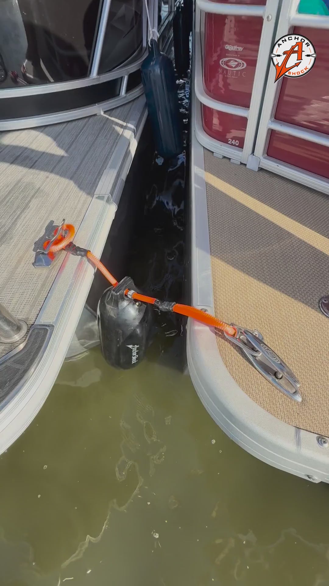 Bumper Shock video: orange shock line and marine bumper hung between two rafted pontoons to take the hit and stop the banging